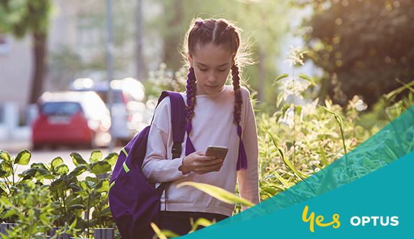 Young girl looking at her phone